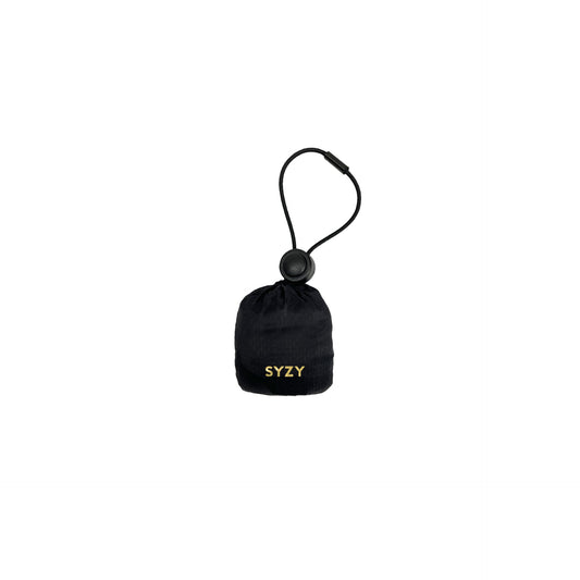 A Black Tetra Tote Bag pouch with a drawstring closure and a black clasp. The syzy logo is visible on the front of the pouch.